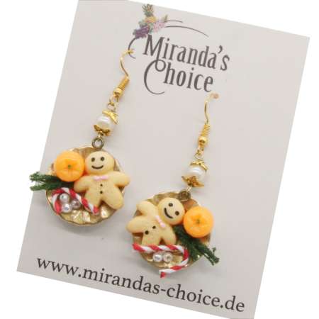 Earrings with Christmas nibbles arranged on a golden plate