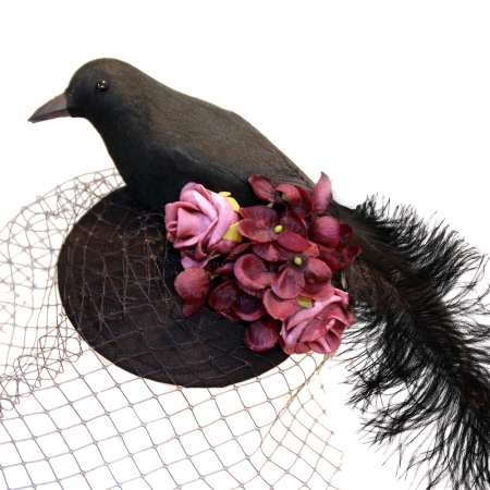 Black fascinator with birdcage veil, raven and purple flowers