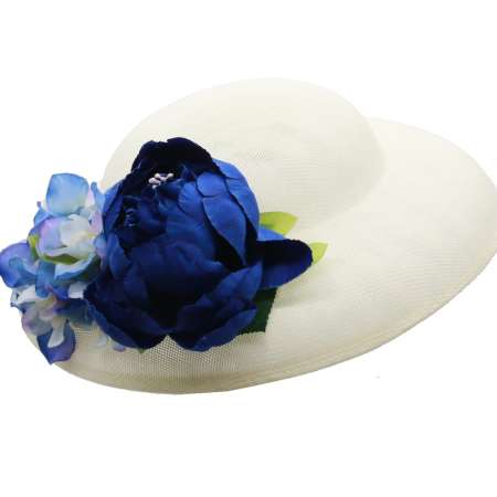 light hat with blue flower corsage