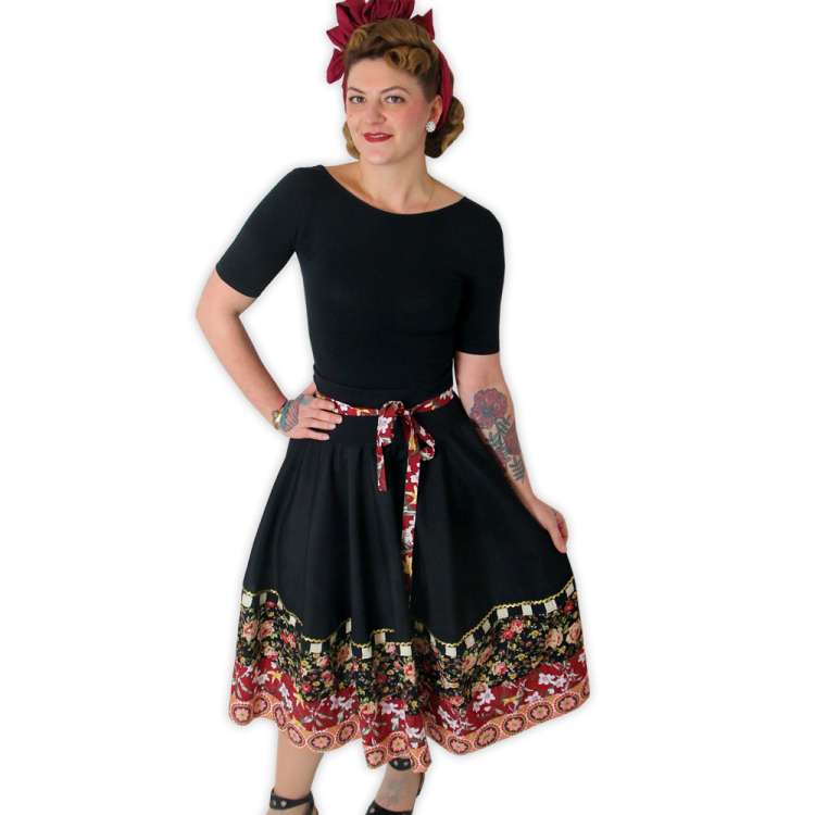 Woman in black swingskirt with colorful hemline