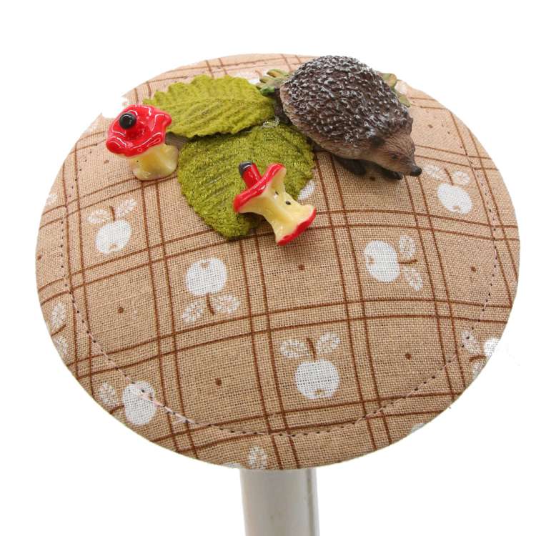 fascinator at fall with hedgehog & apple