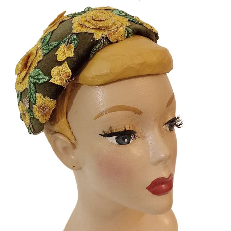 green yellow cocktail hat with flower