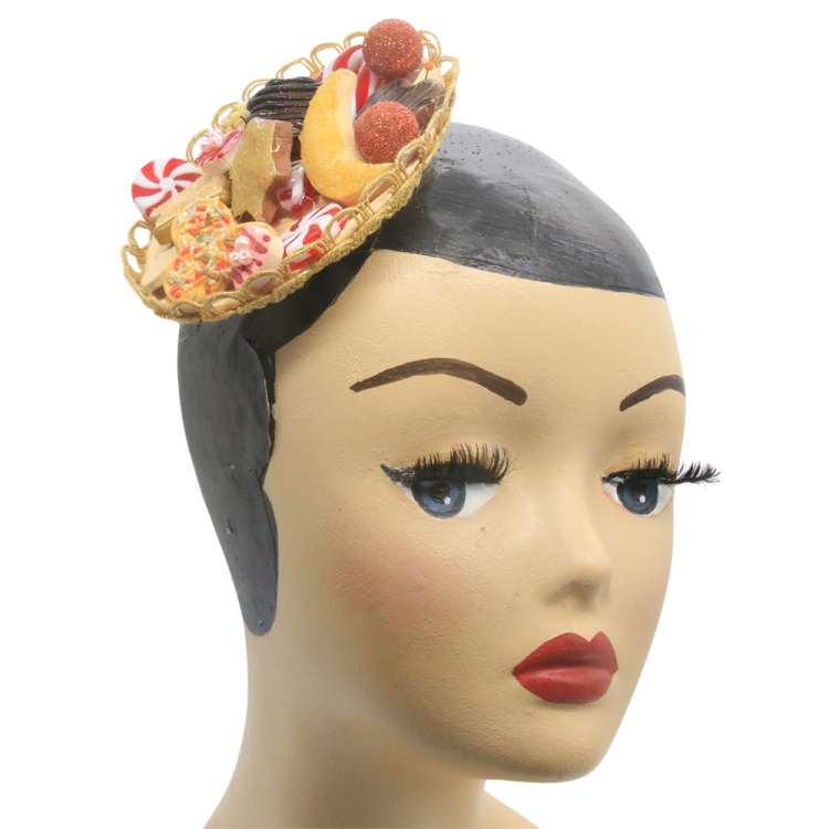 head with Christmas fascinator and cookies