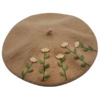 Beret with decorative flowers in camel