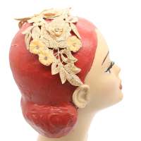 Golden flat bandeau half hat made from elegant floral lace