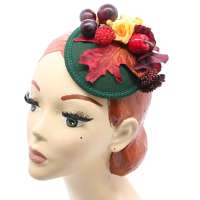 Dark green fascinator with autumn leaves