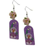 Earrings with glittering resin pendants and flowers