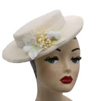 Small hat made of wool fabric in ivory in vintage style