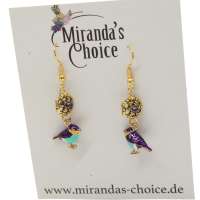 Earrings with a small golden and purple bird
