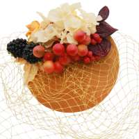 Fascinator in ochre yellow with veil (birdgcage) and flowers